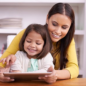 Naperville Preventive Dentistry Mother and Daughter using tablet