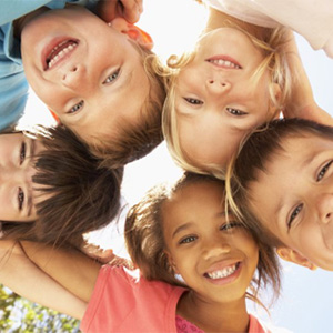 A group of children smiling.