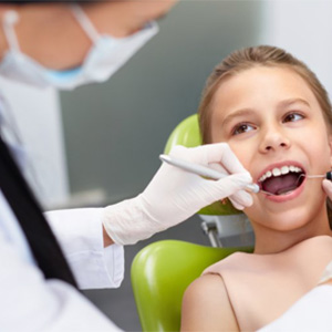 A young child at her dental exam.