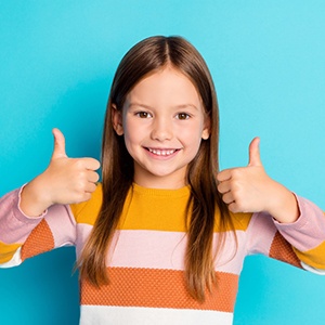 Confident girl giving two thumbs up