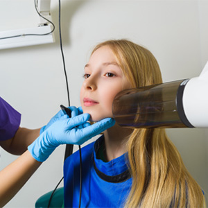 Child receiving dental x-rays