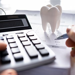 Calculator and tooth model on paper