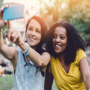 two teenagers smiling for photo