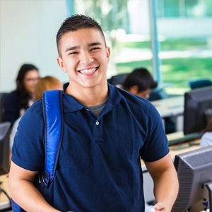 Smiling teenage boy at school