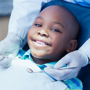 Child smiling at dental checkup