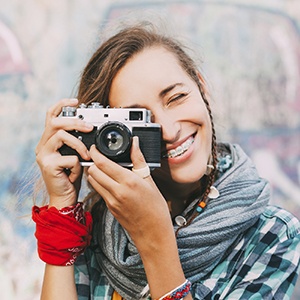 Naperville Orthodontics Lady holding camera smiling