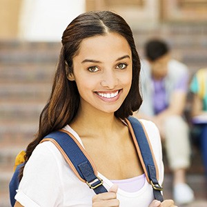 Young lady with backpack smiling