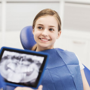Female patient preparing for an oral cancer screening in Chesterfield 