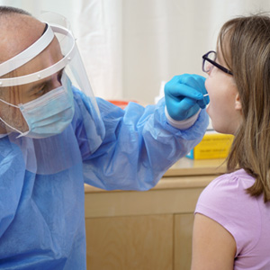 Dentist checking patient’s mouth 