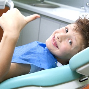 boy gives a thumbs up to his Naperville pediatric dentist