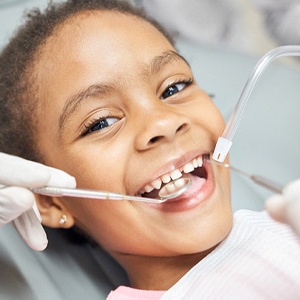 Little girl smiles at her Naperville pediatric dentist 