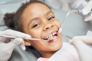 child visiting their kid's dentist in Naperville for a checkup and cleaning