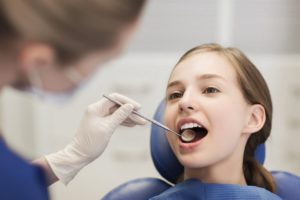 Teenager visiting her dentist for teens in Naperville