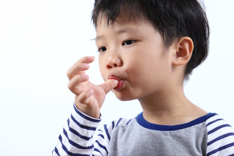 Naperville child sucking their thumb