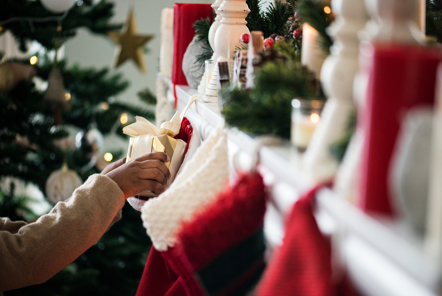 person putting present in stocking